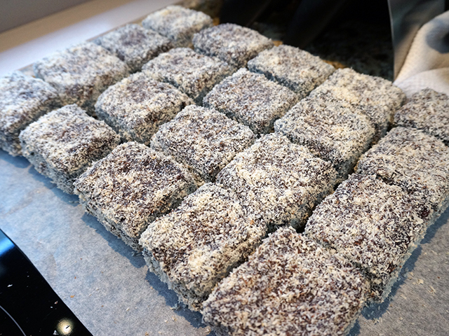 the finished lamingtons drying on a wire rack