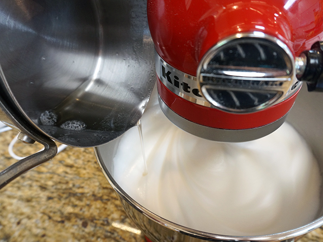 slowly add syrup to egg white mixture